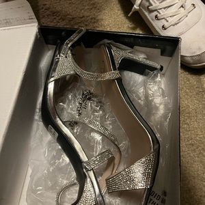 Silver high heels worn once